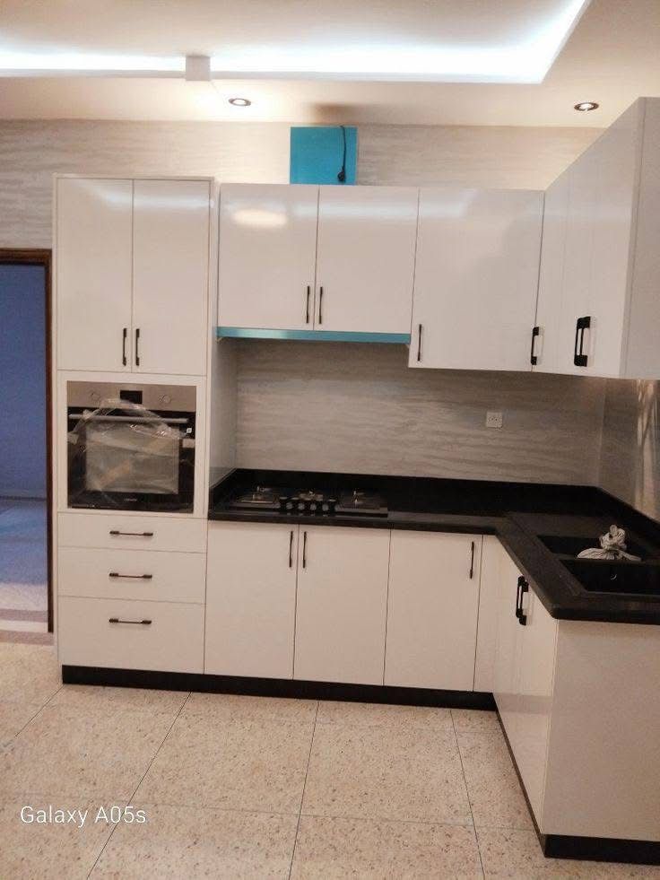 Sleek L-Shaped White Kitchen